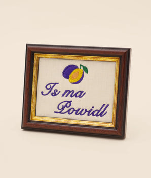 Is ma Powidl — Embroidered Austrian Saying