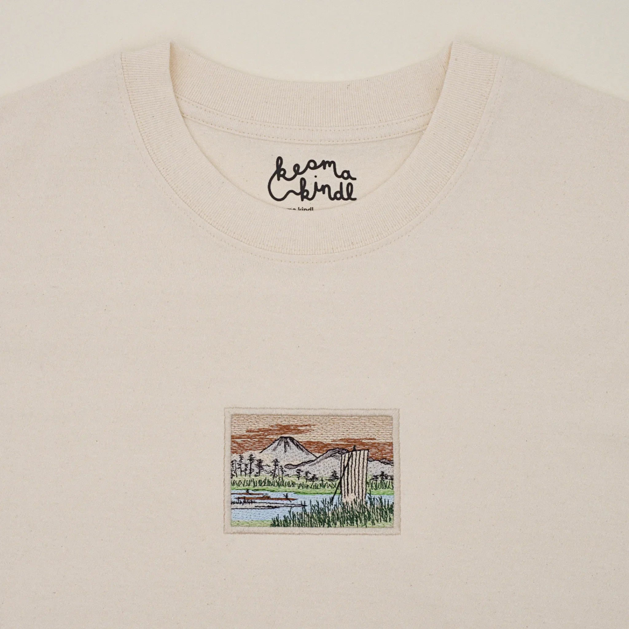Natural white T-shirt machine embroidered with a Mount Fuji design after Hiroshige's Sagami River on the chest