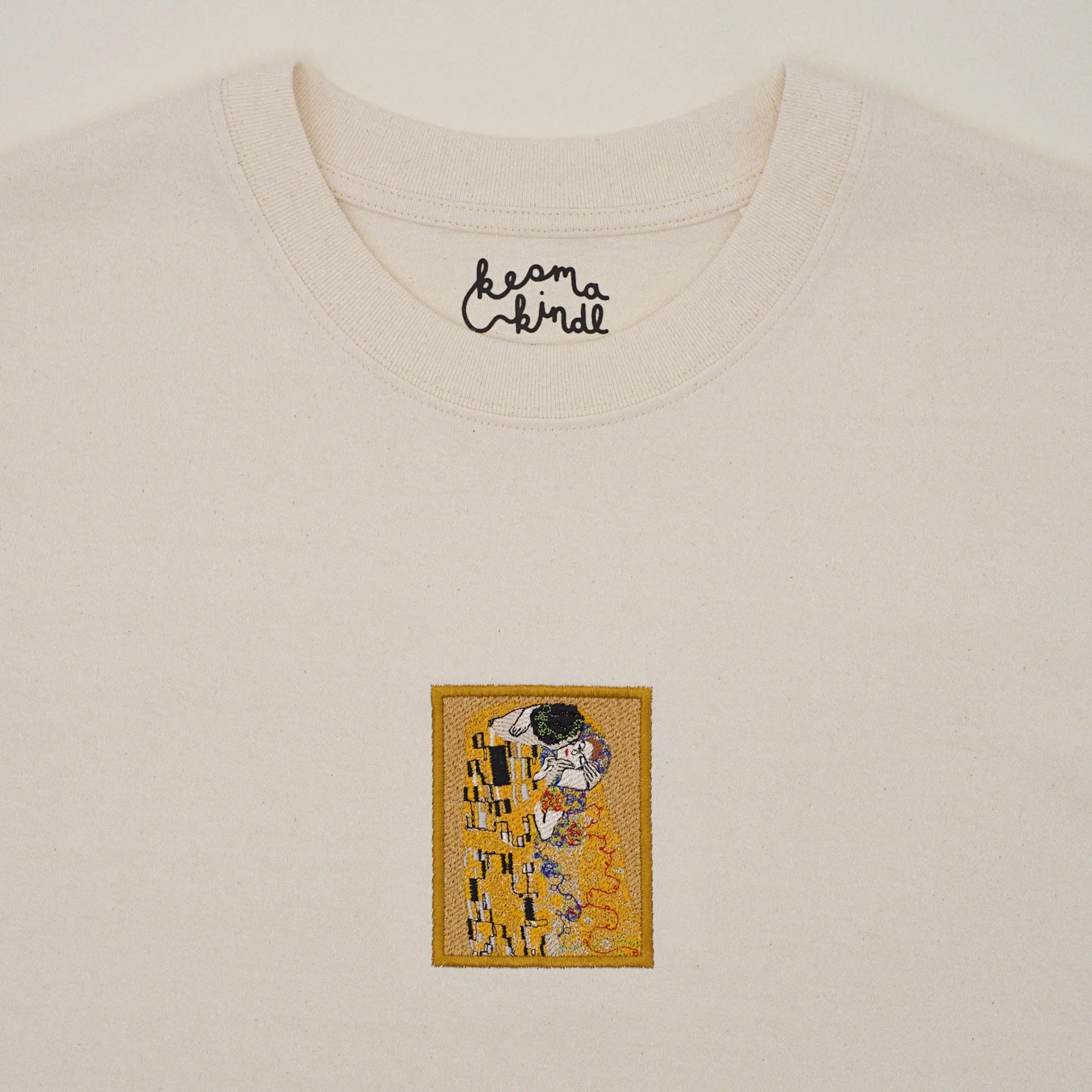 Embroidered T-shirt with Klimt's The Kiss in gold, machine embroidered at the center of the chest